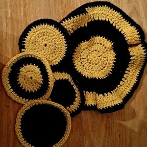 Handmade crochet hot pad/dishcloth and 4 coasters. Deep purple and gold.